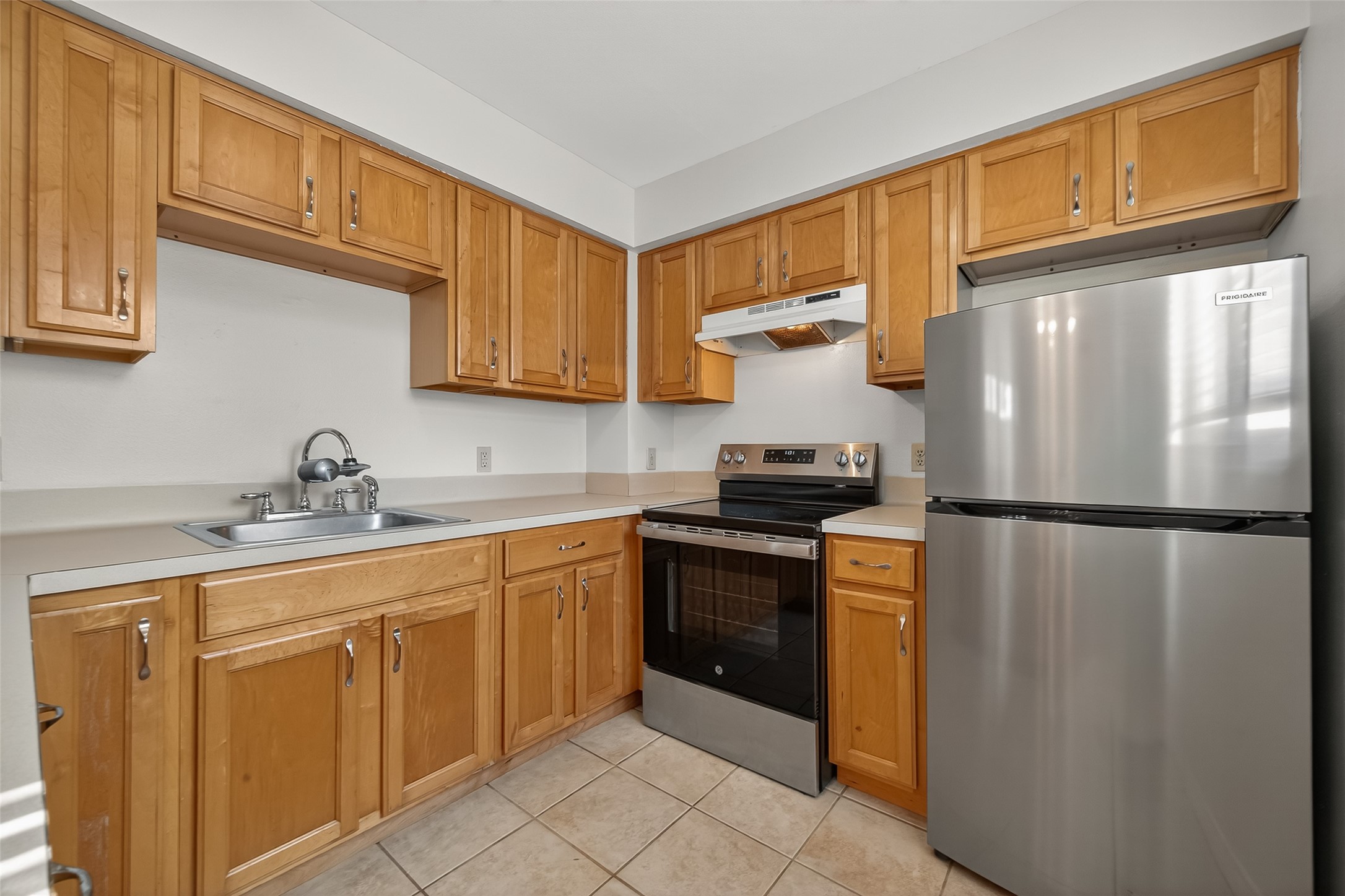 2020 Huldy Street, Unit 10 Houston, TX 77019 - Photo 15 of 24 a kitchen with stainless steel appliances granite countertop a refrigerator a sink and dishwasher