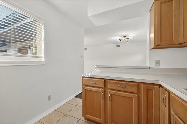 a kitchen with cabinets appliances and a sink