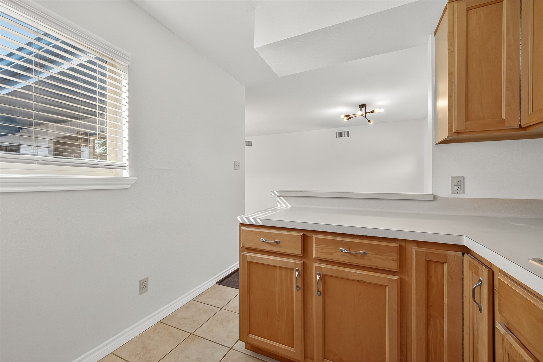2020 Huldy Street, Unit 10 Houston, TX 77019 - Photo 18 of 24 a view of a kitchen with white cabinets