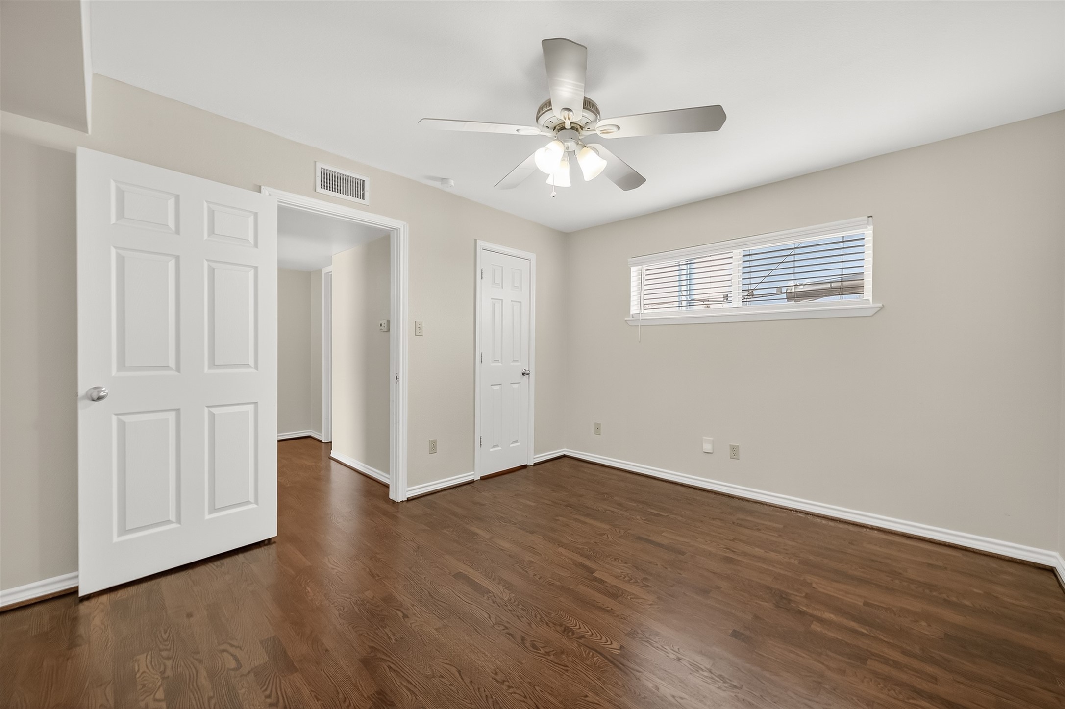 2020 Huldy Street, Unit 10 Houston, TX 77019 - Photo 22 of 24 a view of an empty room with wooden floor