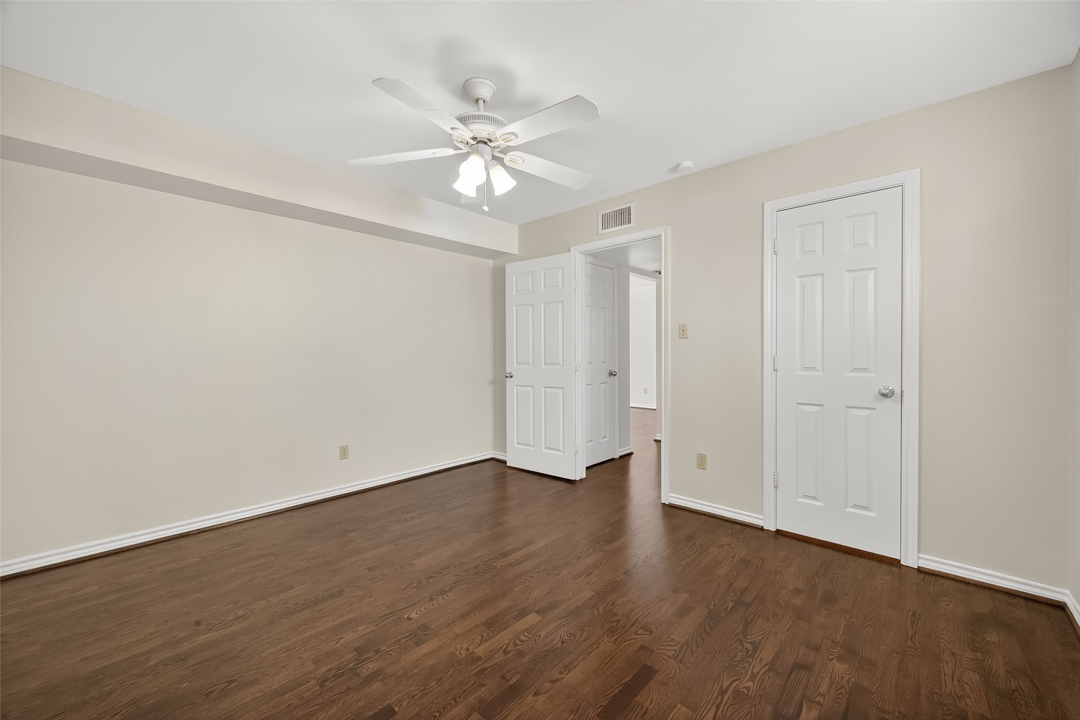 2020 Huldy Street, Unit 10 Houston, TX 77019 - Photo 23 of 24 a view of an empty room with wooden floor