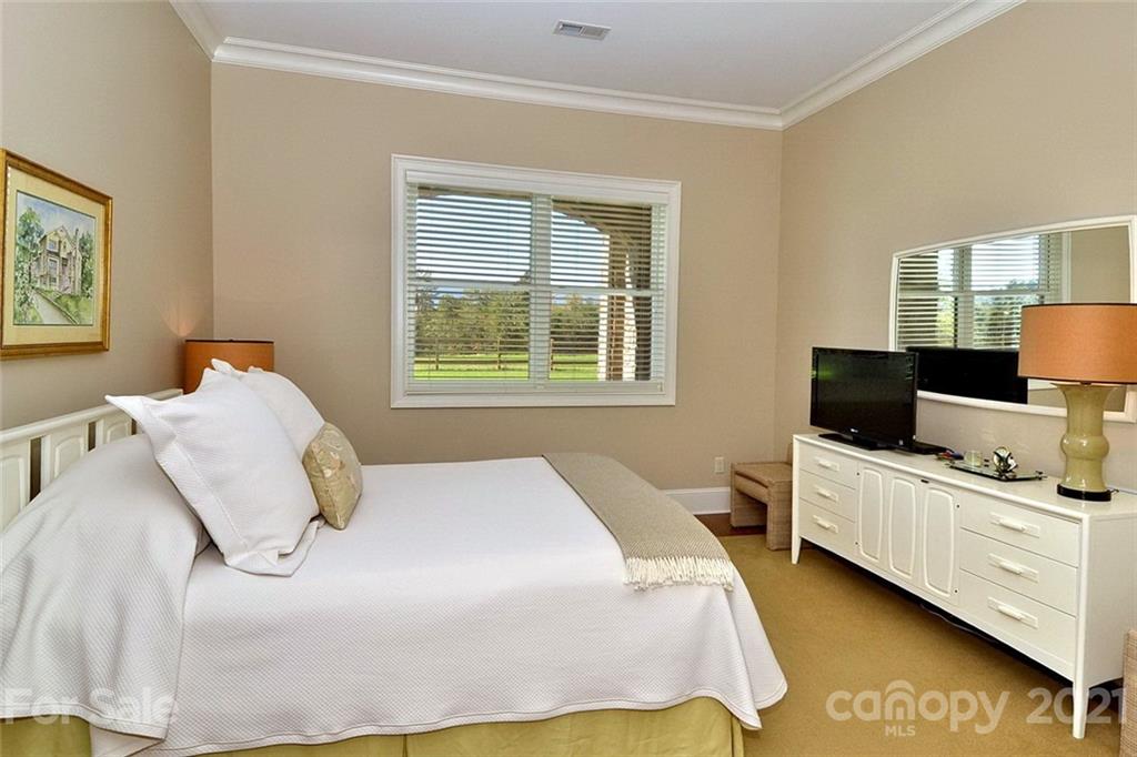 352 Windflower Ln Mill Spring Tryon, NC 28782 - Photo 12 of 43 a bedroom with a bed and window