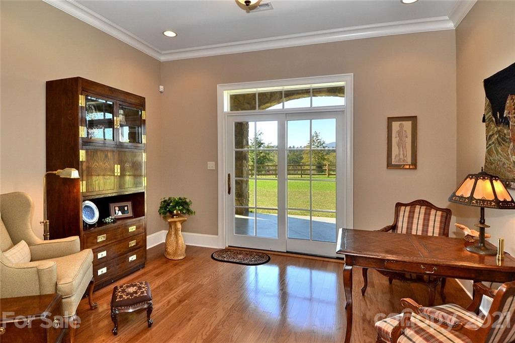 352 Windflower Ln Mill Spring Tryon, NC 28782 - Photo 13 of 43 a living room with furniture and a window