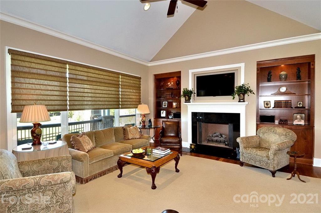 352 Windflower Ln Mill Spring Tryon, NC 28782 - Photo 17 of 43 a living room with furniture a fireplace and a flat screen tv