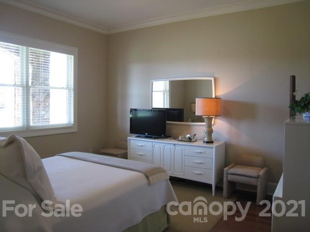 352 Windflower Ln Mill Spring Tryon, NC 28782 - Photo 22 of 43 a bedroom with a bed and a window