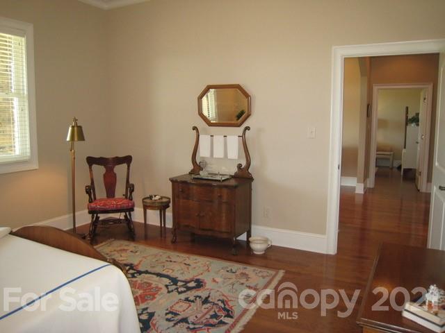352 Windflower Ln Mill Spring Tryon, NC 28782 - Photo 26 of 43 a bedroom with a bed and a chair