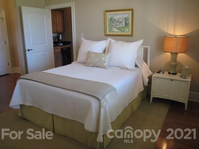 352 Windflower Ln Mill Spring Tryon, NC 28782 - Photo 28 of 43 a bedroom with a bed and lamp