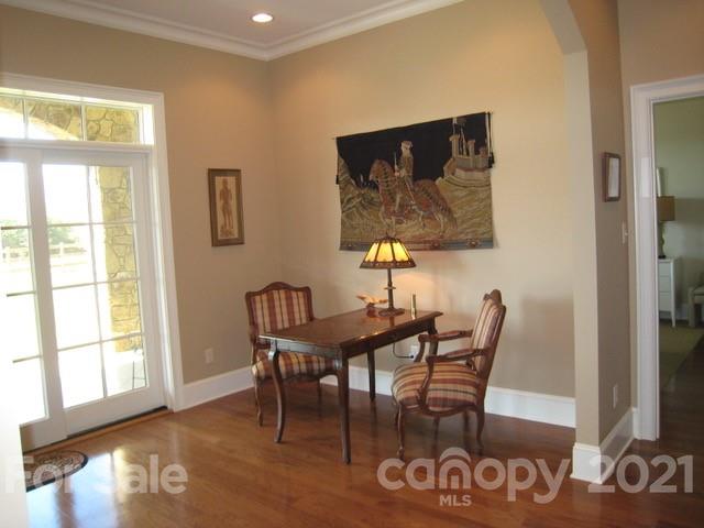 352 Windflower Ln Mill Spring Tryon, NC 28782 - Photo 30 of 43 a view of a dining room with furniture and wooden floor