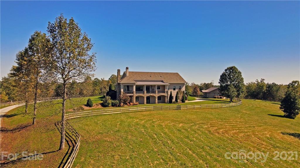 352 Windflower Ln Mill Spring Tryon, NC 28782 - Photo 40 of 43 a view of a swimming pool with an outdoor space and seating area