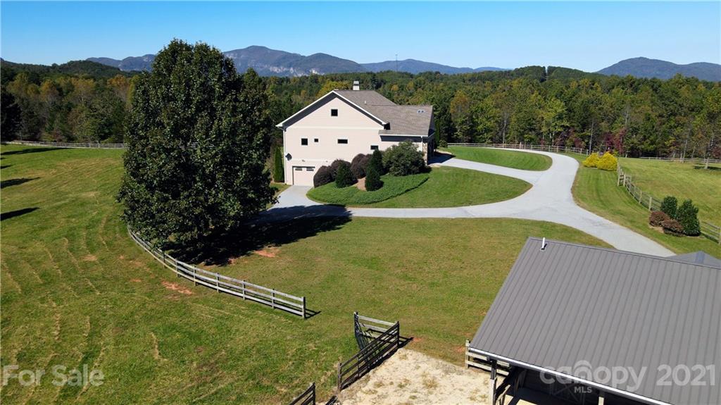 352 Windflower Ln Mill Spring Tryon, NC 28782 - Photo 41 of 43 a view of a swimming pool with a yard