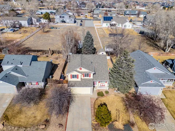 an aerial view of residential houses with outdoor space