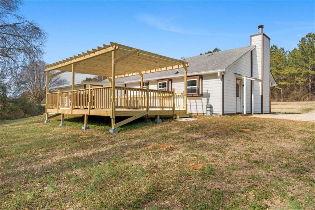 1220 South Hampton Road Hampton, GA 30228 - Photo 2 of 30 a view of a house with a yard