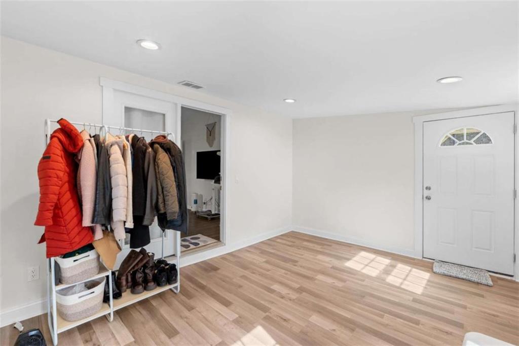 1220 South Hampton Road Hampton, GA 30228 - Photo 23 of 30 a view of walk in closet with clothes