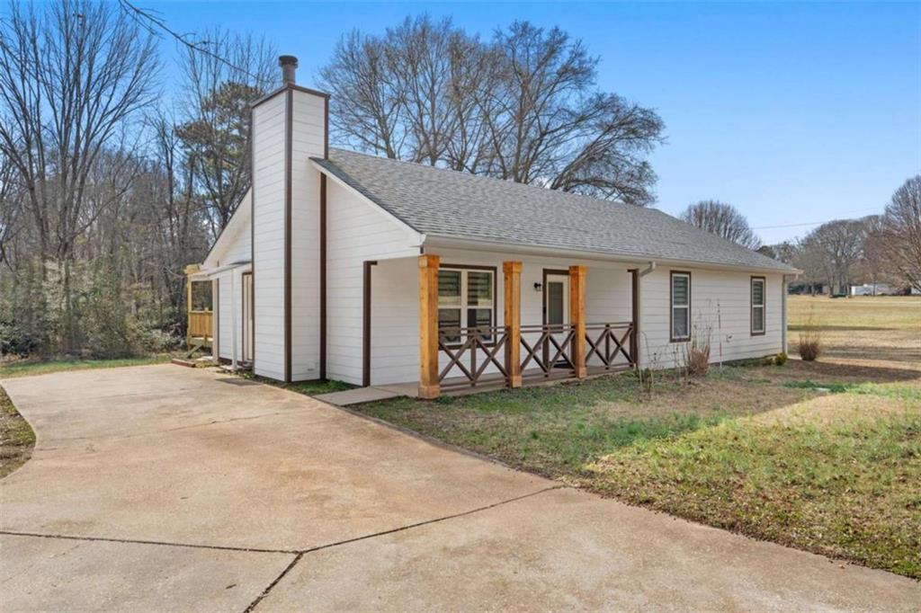 1220 South Hampton Road Hampton, GA 30228 - Photo 25 of 30 a front view of a house with a garden