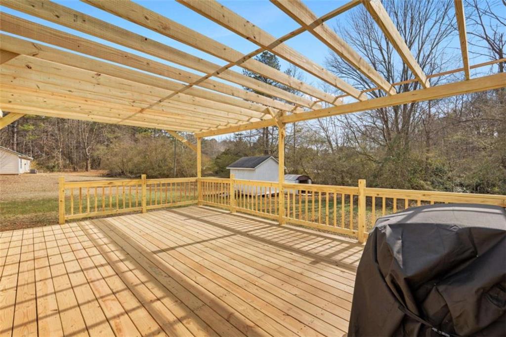 1220 South Hampton Road Hampton, GA 30228 - Photo 30 of 30 a view of a balcony with wooden floor and fence
