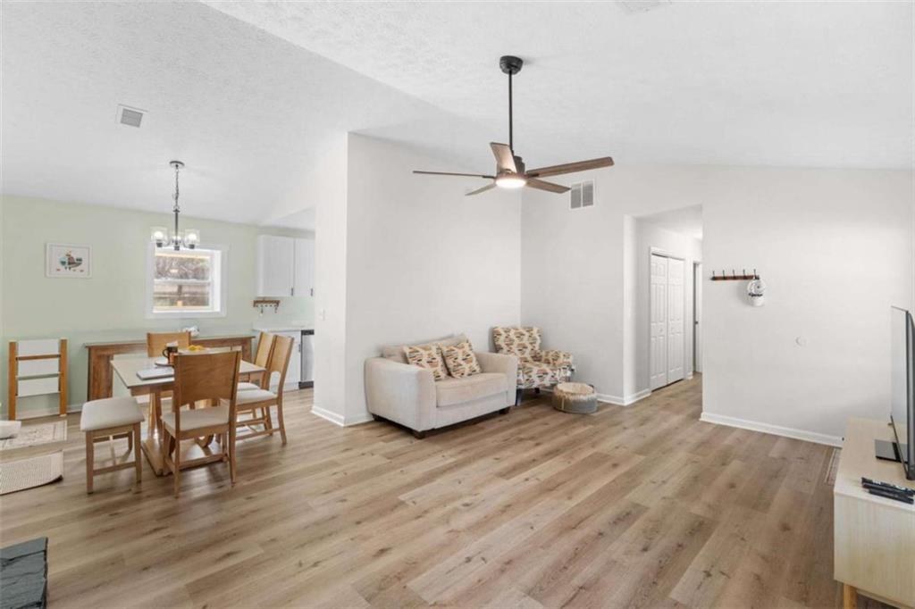 1220 South Hampton Road Hampton, GA 30228 - Photo 6 of 30 a view of a livingroom with furniture and hardwood floor
