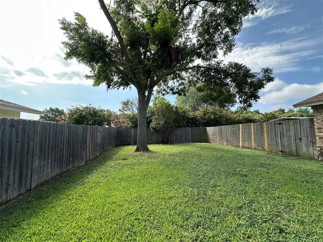 a view of a house with wooden walls and roof