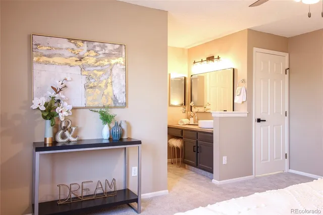 a bathroom with a granite countertop sink a mirror and a shower