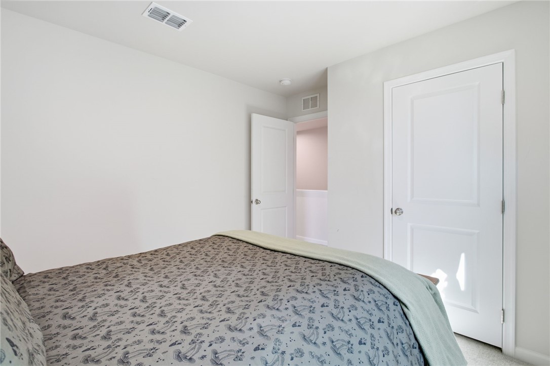 112 Wls Sta Road Seneca, SC 29678 - Photo 25 of 42 Crisp white walls and plush neutral carpeting define this serene upper-level bedroom retreat.