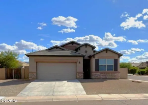 a front view of a house with a garage