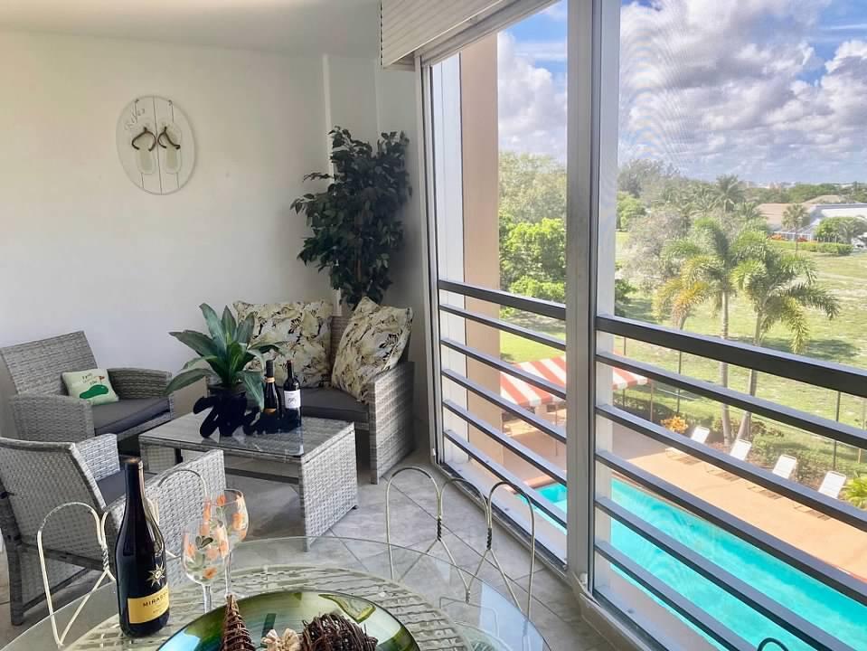 6461 Northwest 2nd Avenue, Unit 409 Boca Raton, FL 33487 - Photo 30 of 57 LANAI OVERLOOKING POOL
