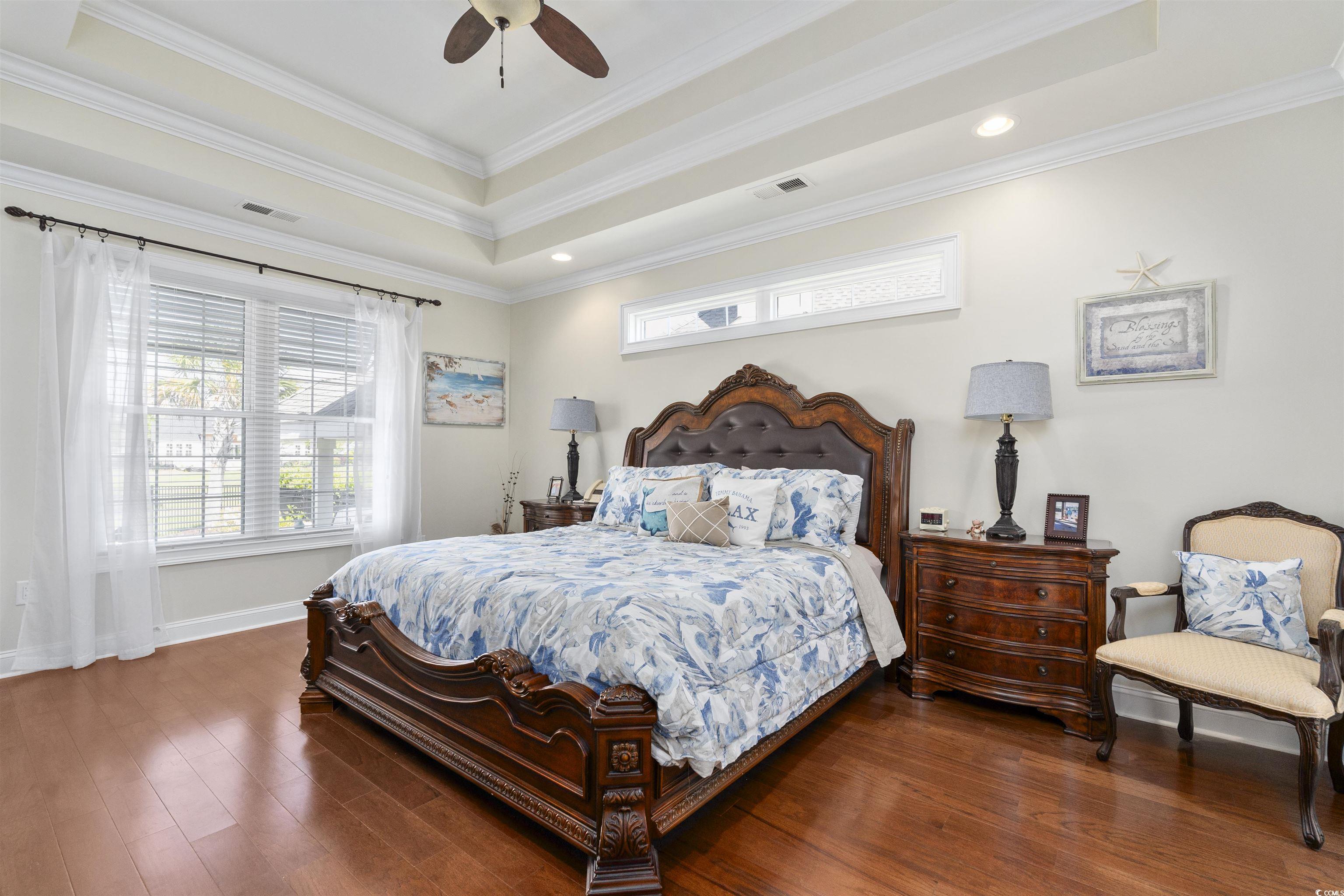 63 Grey Moss Road Murrells Inlet, SC 29576 - Photo 12 of 35 Bedroom featuring baseboards, a tray ceiling, wood
