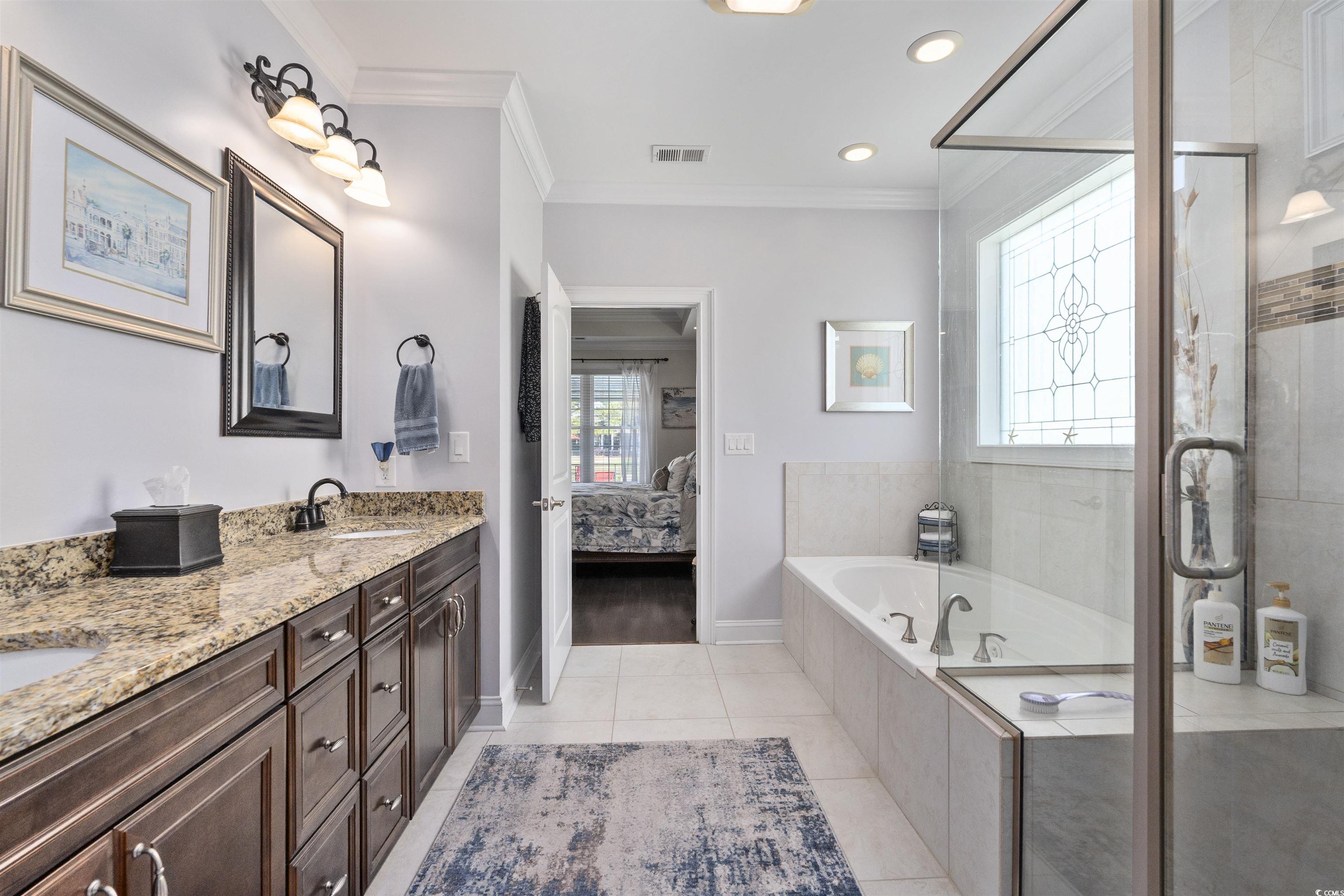 63 Grey Moss Road Murrells Inlet, SC 29576 - Photo 14 of 35 Ensuite bathroom with a sink, a stall shower, doub