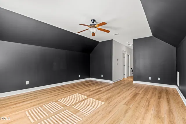 a view of a backyard with table and chairs
