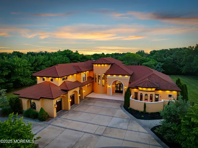 an aerial view of a house with a garden