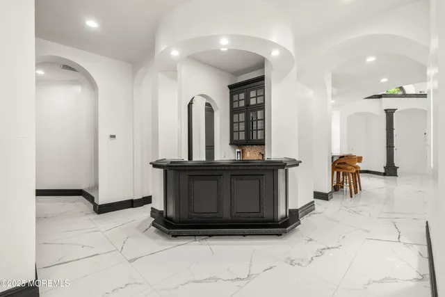 a bathroom with a toilet a sink and a mirror