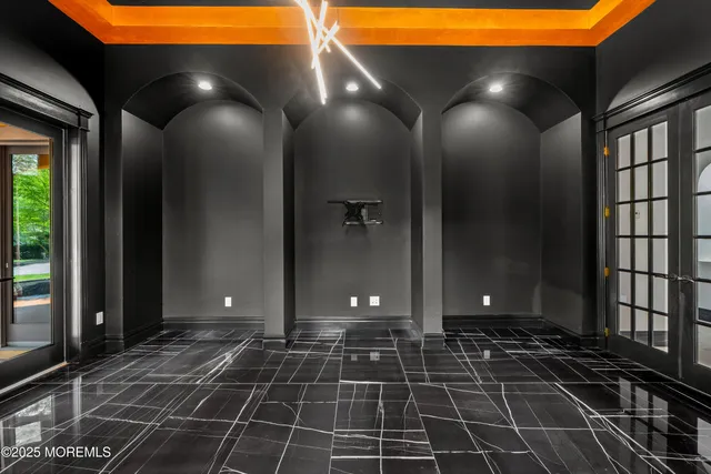 a living room with furniture fireplace and a large window