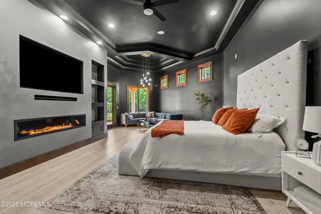 a front view of a house with a yard and trees