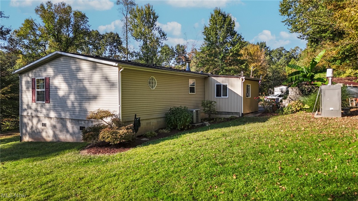 1788 Rosenbush Road Newport, OH 45768 - Photo 6 of 34 View of home's rear exterior with a lawn