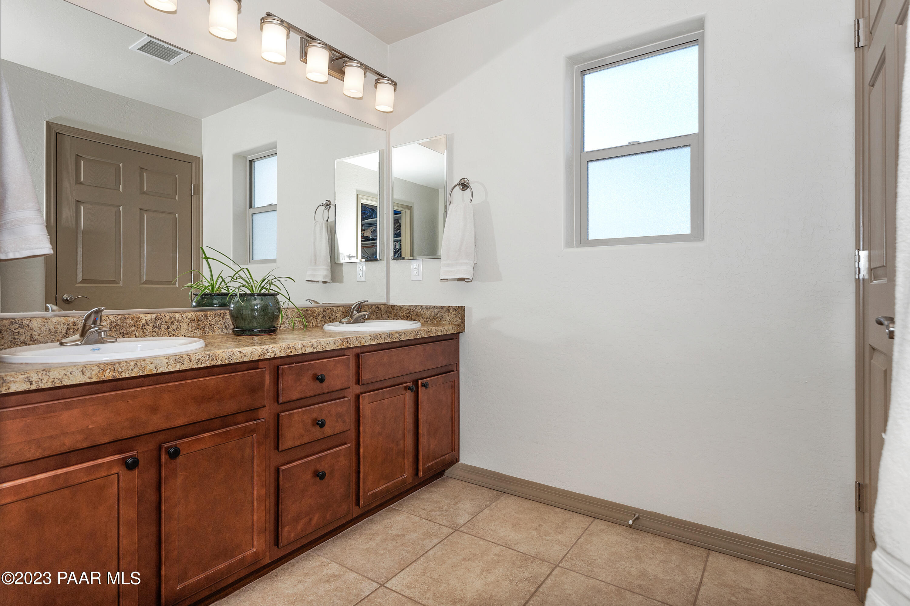 1475 Saddle Road Paulden, AZ 86334 - Photo 11 of 25 a bathroom with a double vanity sink and a mirror