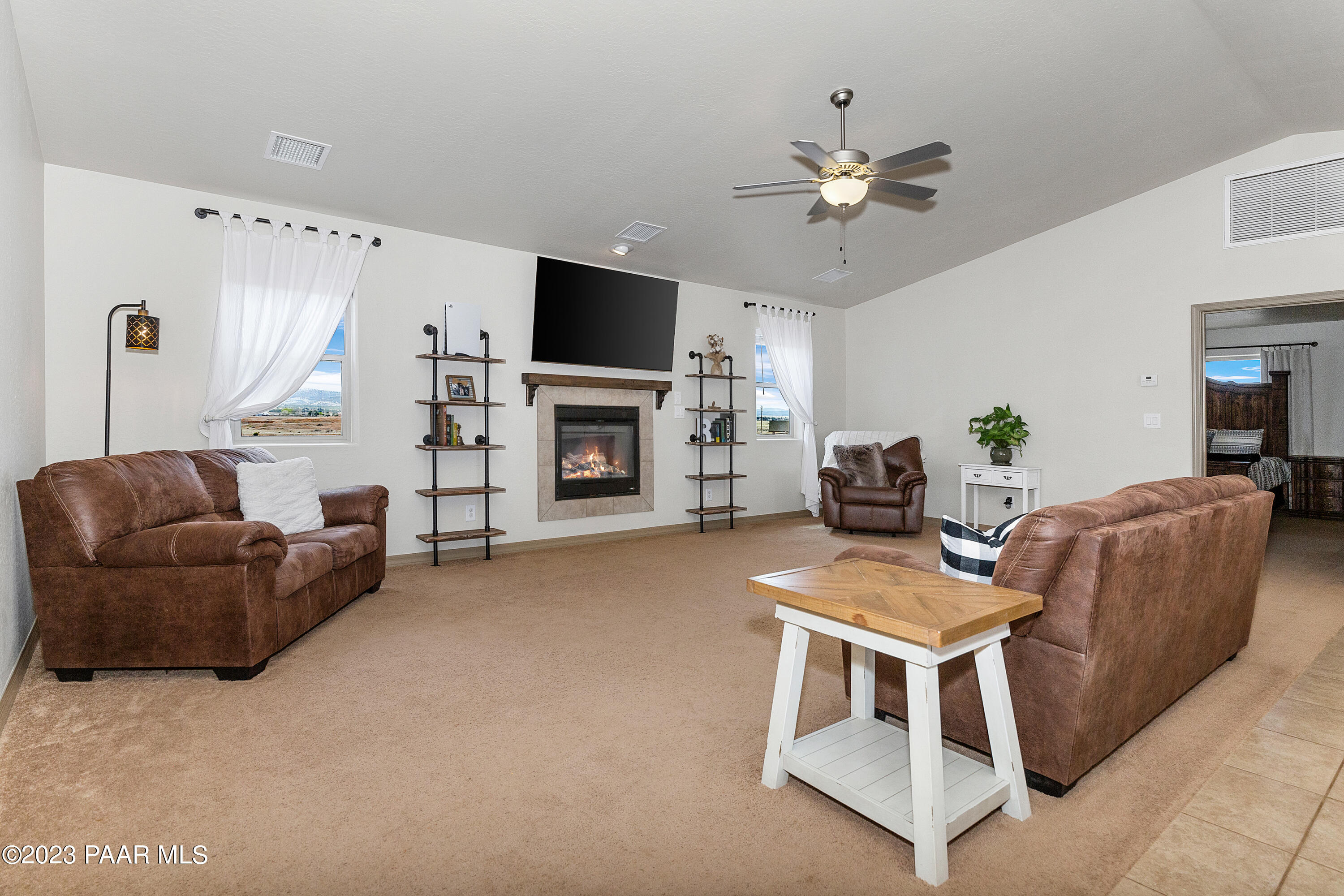 1475 Saddle Road Paulden, AZ 86334 - Photo 5 of 25 a living room with furniture and a flat screen tv