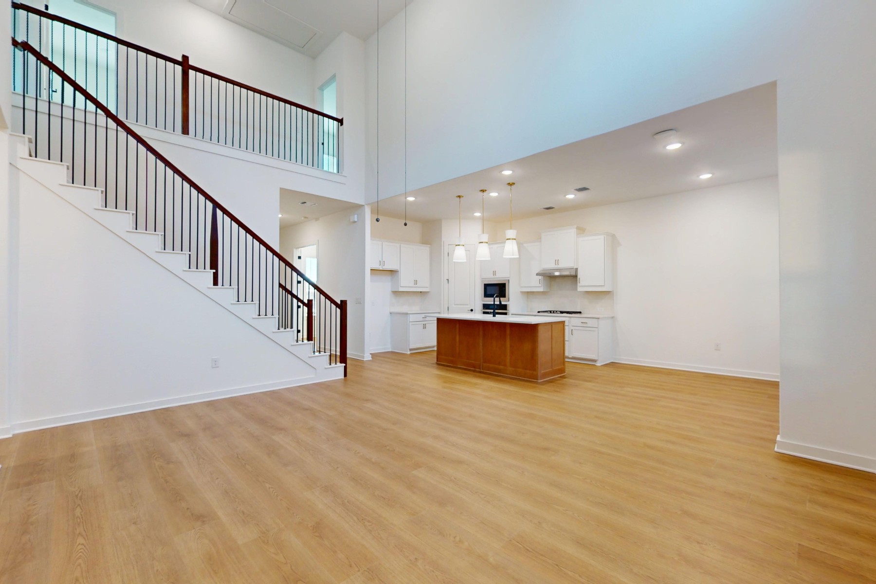 3613 Helena Way Leander, TX 78641 - Photo 14 of 27 a view of an empty room with wooden floor
