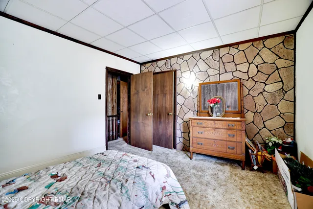 a kitchen with granite countertop a sink a stove and cabinets