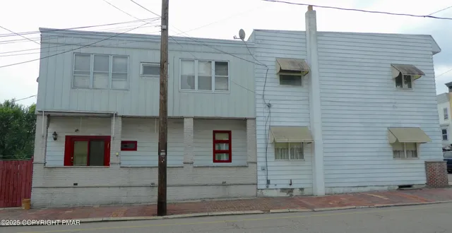 a living room with furniture and window
