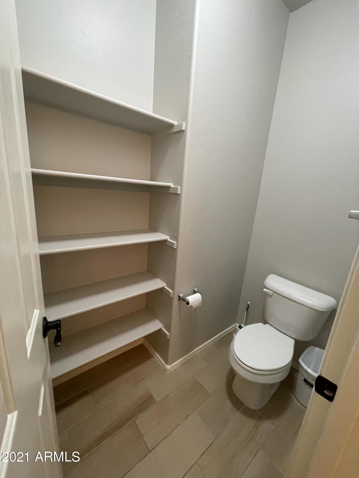 2649 East Gillcrest Road Gilbert, AZ 85298 - Photo 29 of 50 Master toilet w/ extra shelving