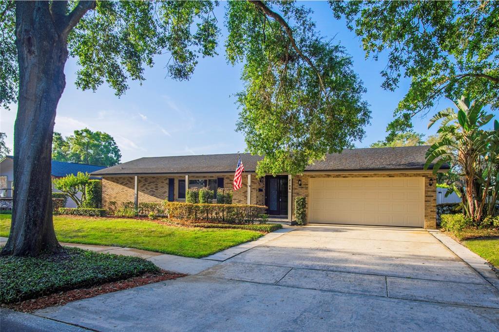 2108 Cree Trail Casselberry, FL 32707 - Photo 1 of 1 a front view of house with yard and green space