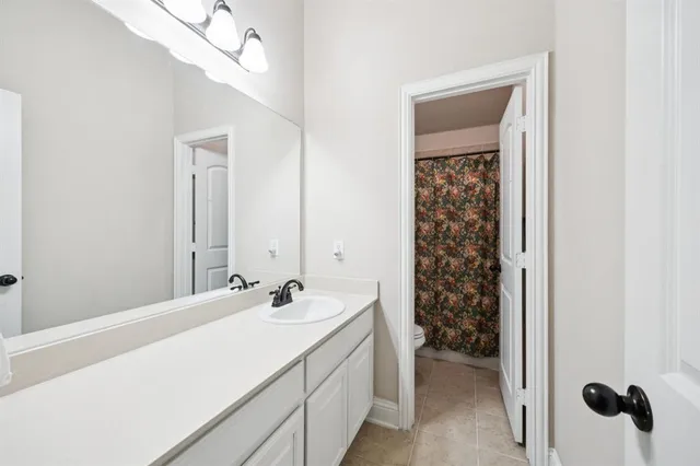 a bathroom with a sink a vanity and a mirror