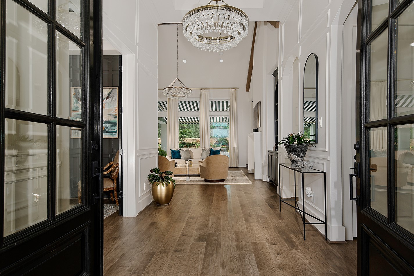 2017 Bennet Lane Conroe, TX 77384 - Photo 8 of 48 Elegant home featuring exquisite chandeliers and a whole-home surround system, combining luxury and modern convenience.