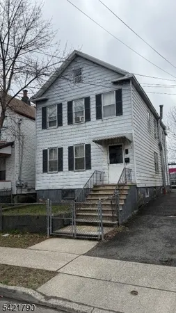 a front view of a house with garage