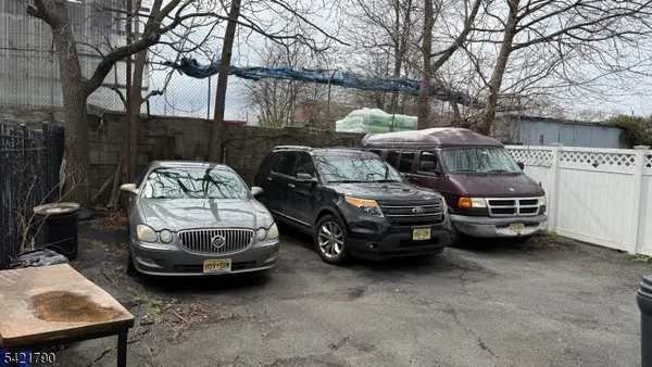 a couple of cars parked in a parking lot