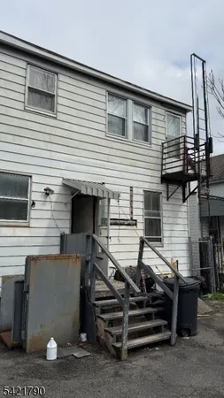 a front view of a house with stairs
