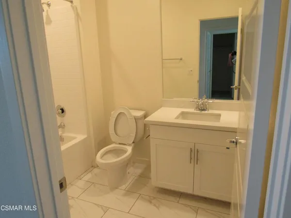 an empty room with a empty space and a window