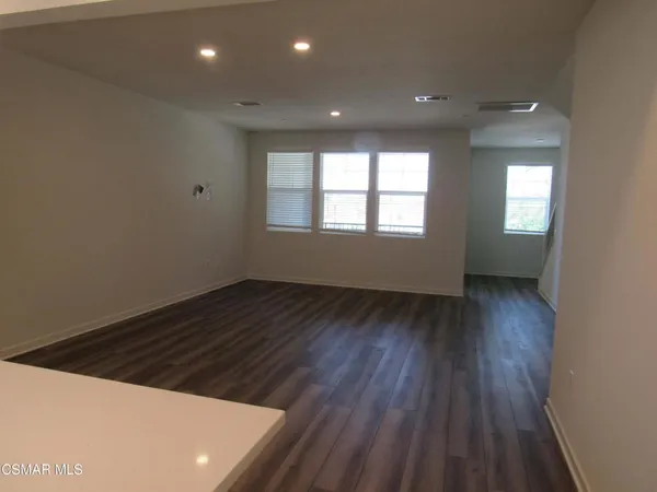 a kitchen with a sink a stove and refrigerator