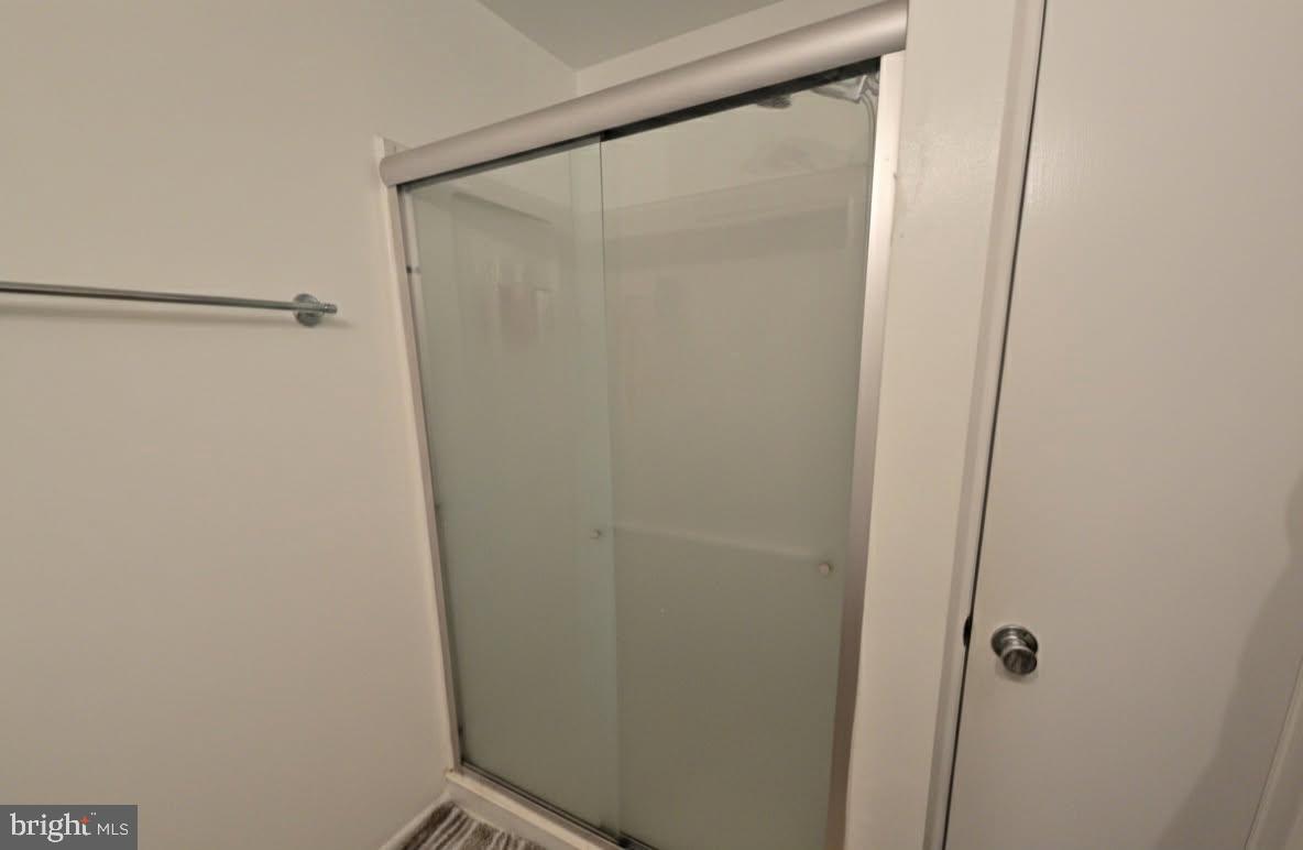 407 Harrier Row Marlton, NJ 08053 - Photo 11 of 13 a bathroom with a glass shower door