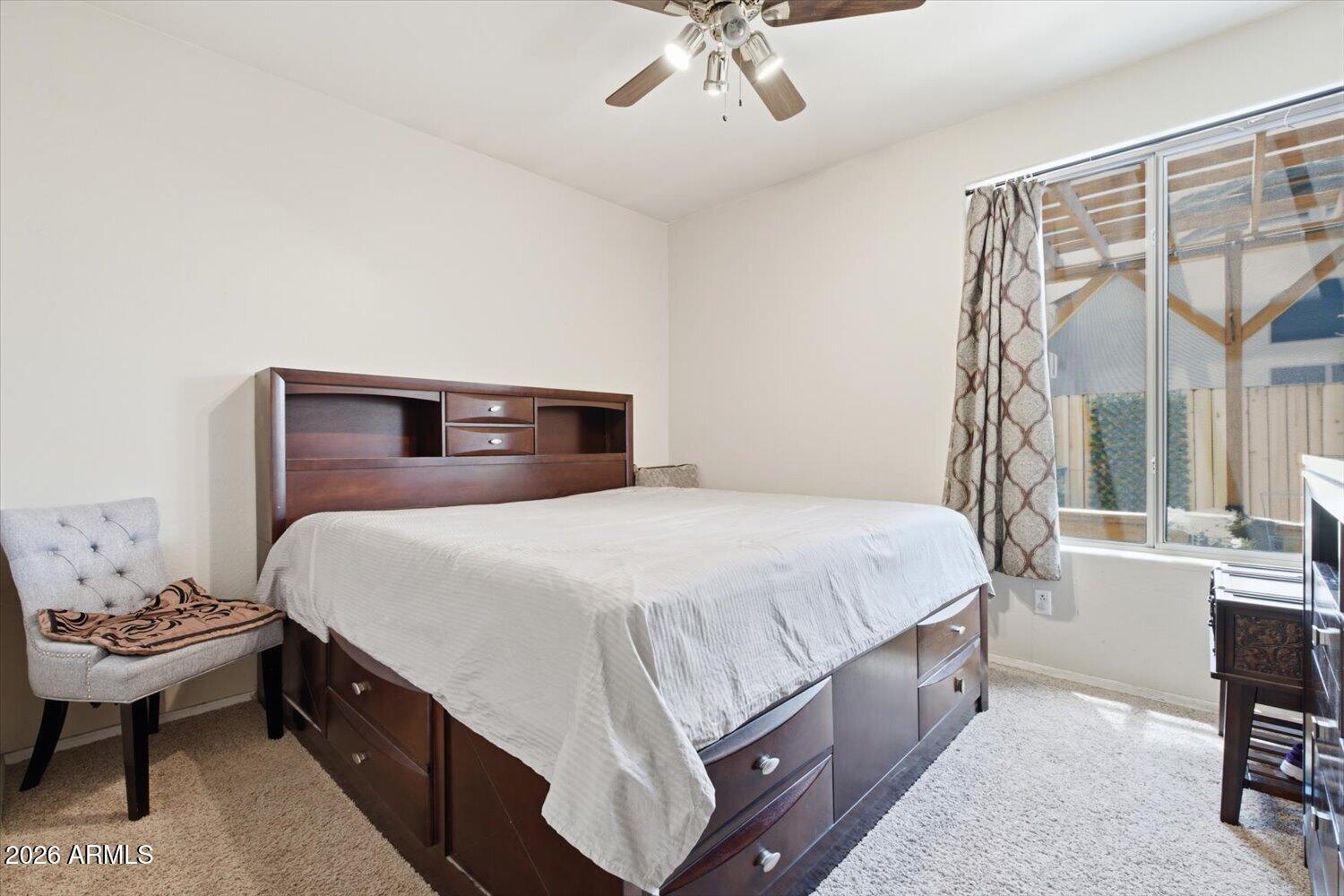 1894 East Mineral Road Gilbert, AZ 85234 - Photo 15 of 48 a bedroom with a bed and a chandelier