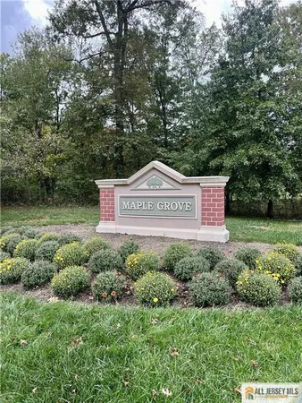 a sign that is sitting in a garden